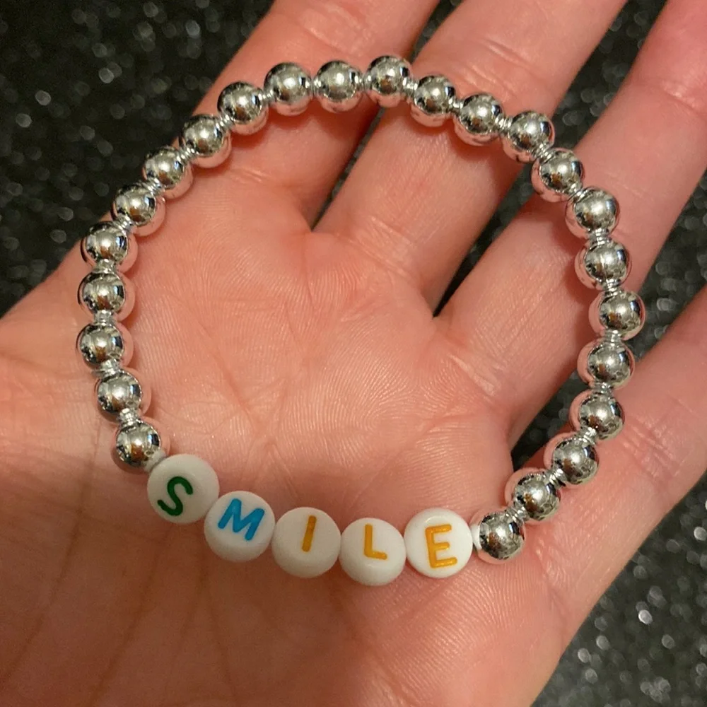 Girls faux silver bead smile stretch bracelet